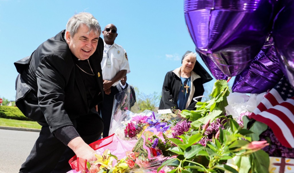 Buffalo bishop lays flowers, personal  prayer at mass shooting memorial