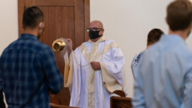 Dominican Father Joseph
Barranger, pastor of St. Thomas Aquinas, incenses the people
during the Rite of Dedication. (Photo/Michael Mickle)