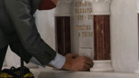 Dan Fagan, project manager, Alexander Nicholson, Inc., seals relics into the altar after Bishop Knestout had placed them inside. (Photos/Michael Mickle)
